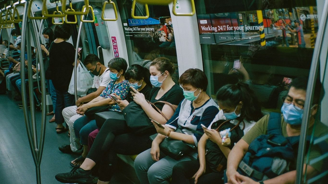 people sitting on train seat
