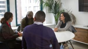 a group of people sitting around a table