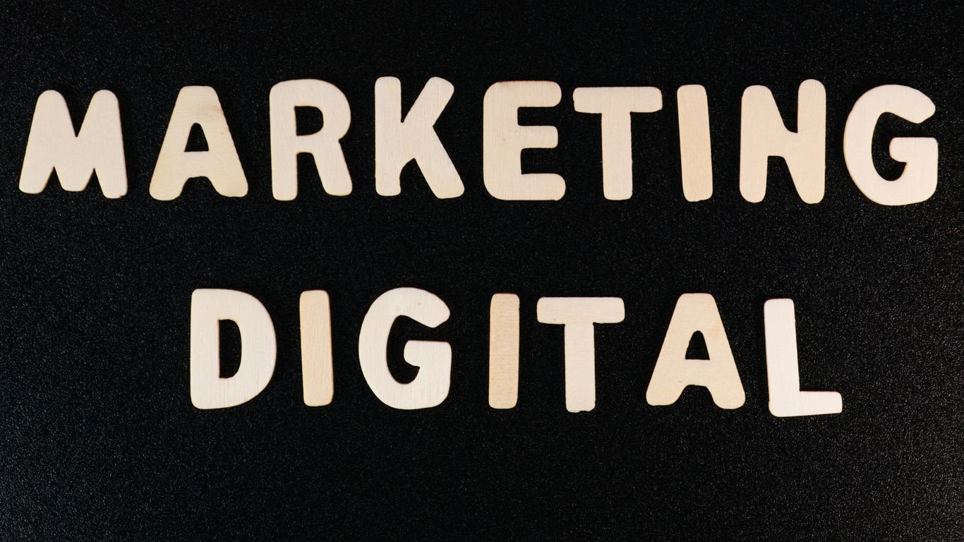 the words marketing and digital written on a black surface