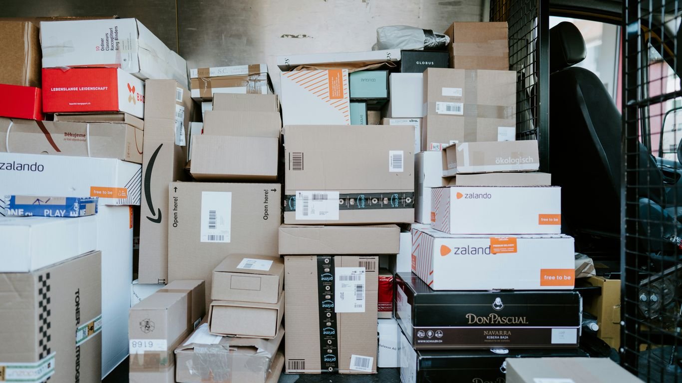 brown cardboard boxes on black plastic crate