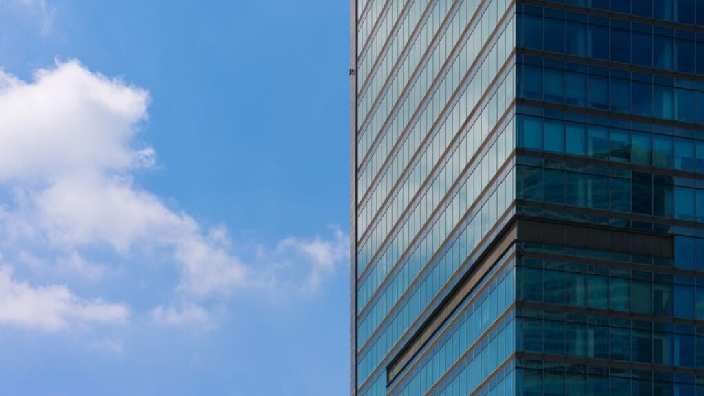 A very tall building with a clock on it's side