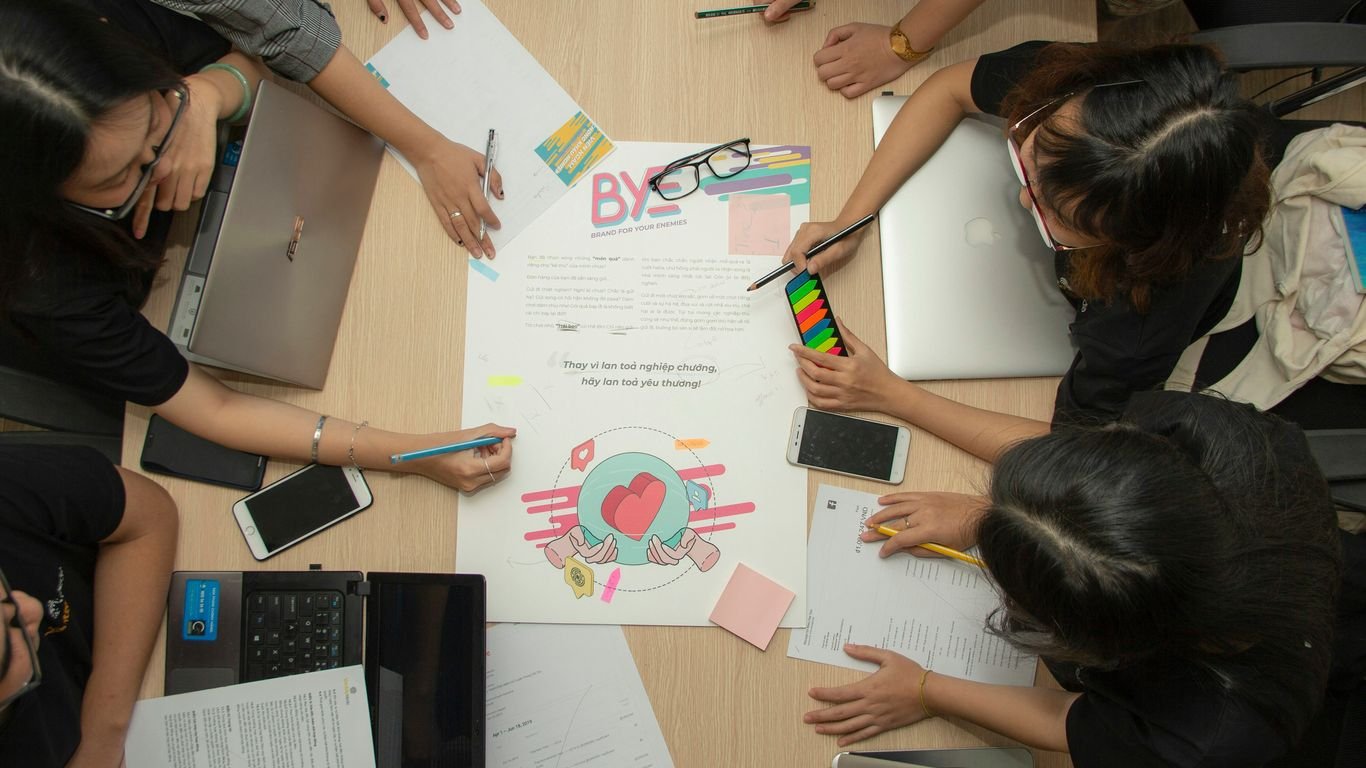 people having meeting beside table