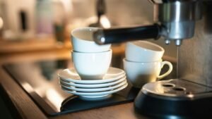 a stack of white cups sitting on top of a counter