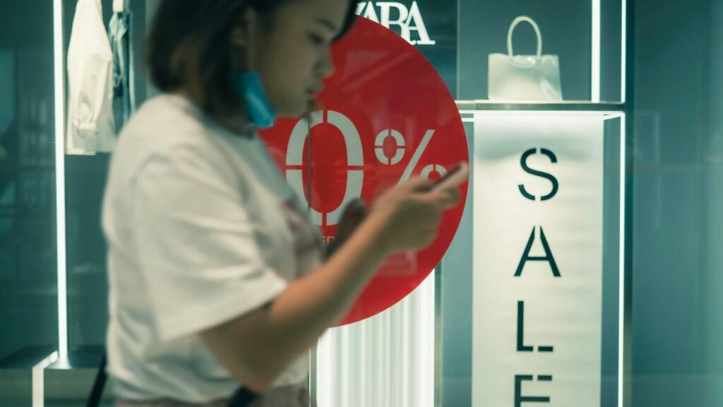 woman in white t-shirt standing near white wall