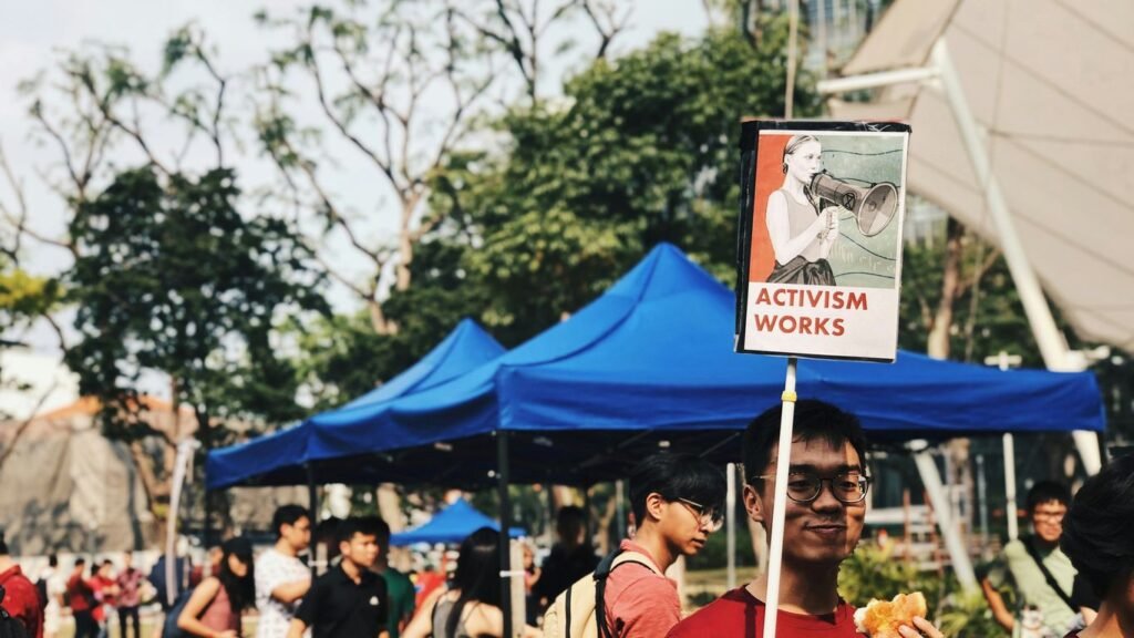 people holding blue and white banner during daytime