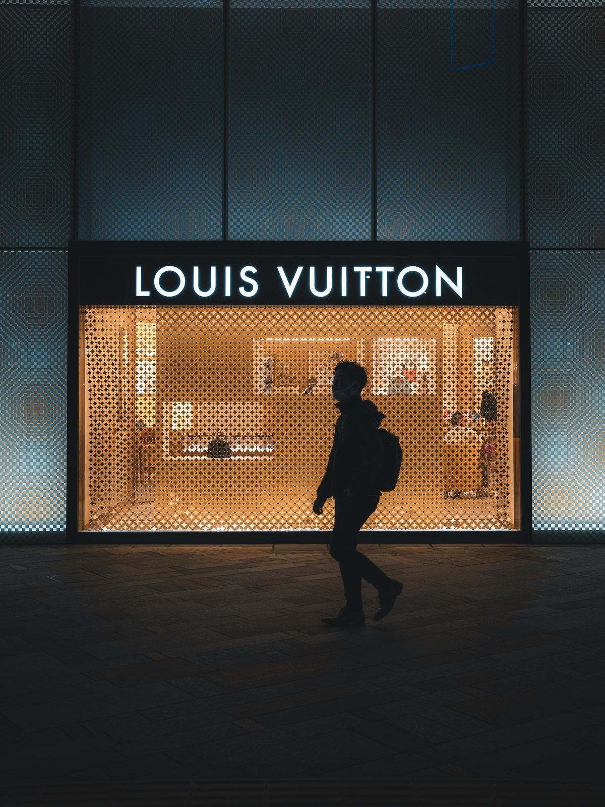 Illuminated retail façade signage at night