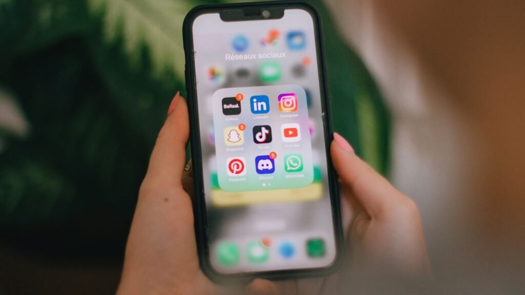 A person holding a cell phone in their hand
