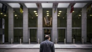 man standing in front of building