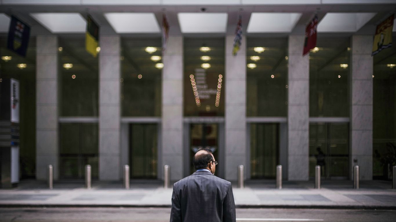man standing in front of building