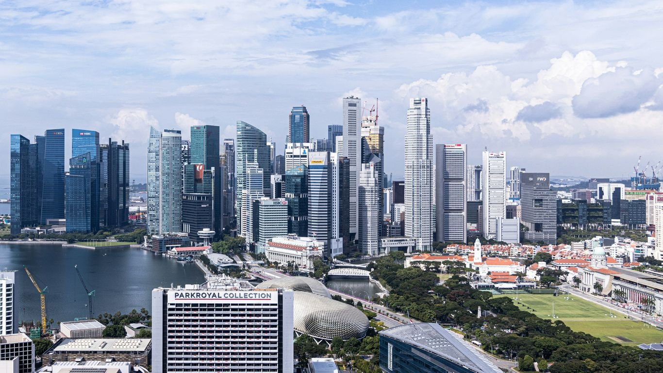 city buildings near body of water during daytime