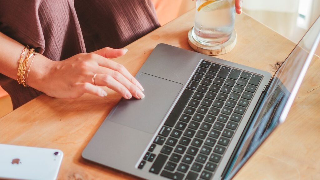Small business owner in Singapore reviewing an online marketing dashboard covering SEO, SEM and social media performance