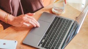 Small business owner in Singapore reviewing an online marketing dashboard covering SEO, SEM and social media performance