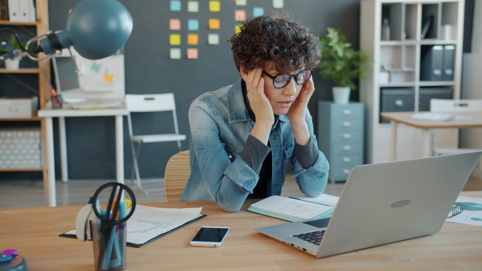 Singapore business owner looking stressed at his laptop after realising his website is losing customers