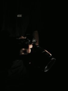 Hand holding a professional DSLR camera used for a Singapore business's professional photography