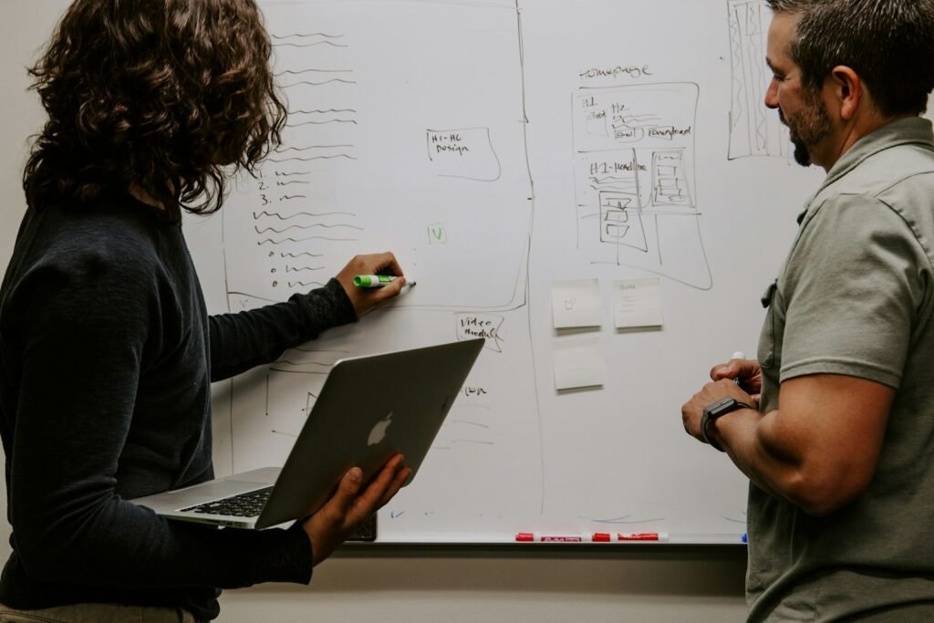 Singapore SME owner mapping out a digital marketing strategy on a whiteboard
