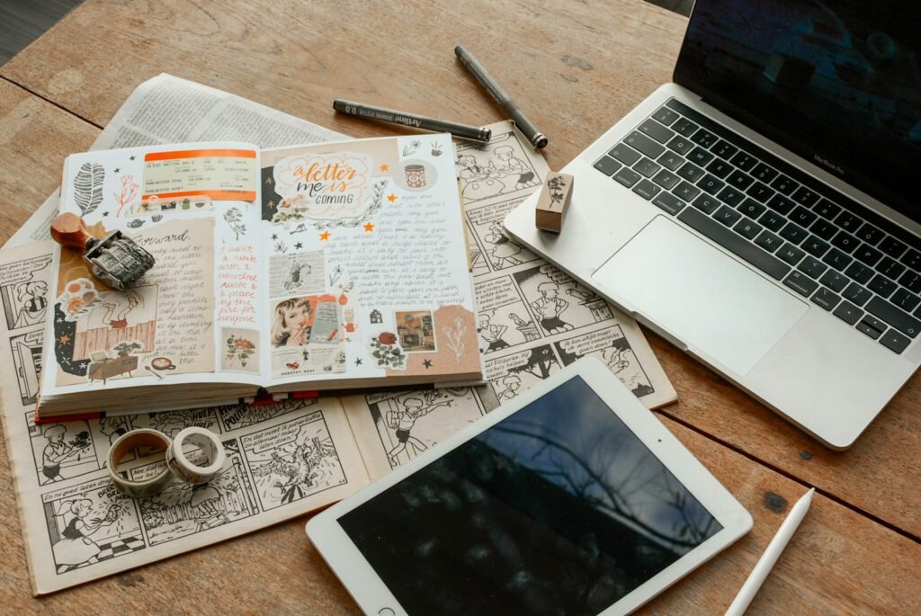 iPad, laptop and book side by side representing a Singapore SME weighing content marketing against traditional marketing channels