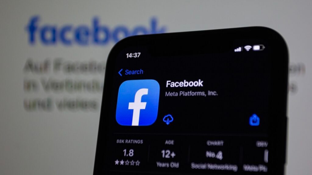 Close-up of a smartphone with the Facebook app open, the platform covered in this Singapore Facebook marketing guide