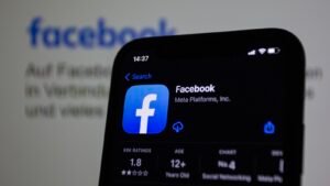 Close-up of a smartphone with the Facebook app open, the platform covered in this Singapore Facebook marketing guide