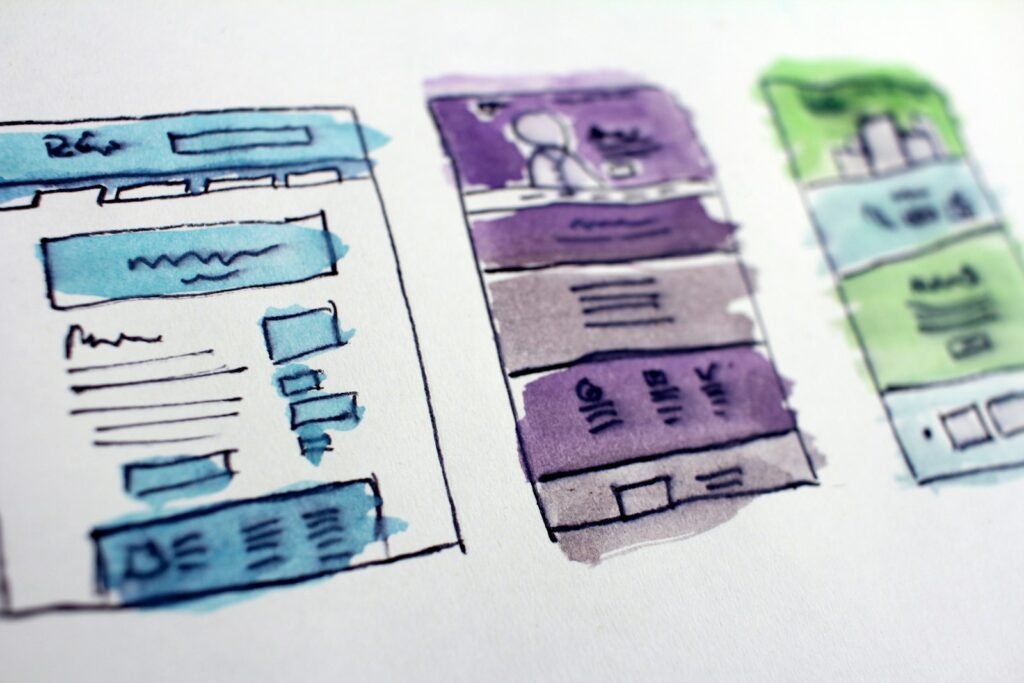 Hand-drawn wireframe sketches of website page layouts, part of the web design process Singapore businesses pay for