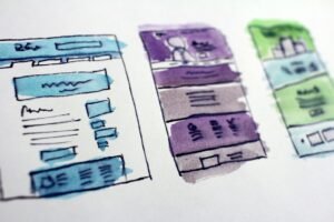 Hand-drawn wireframe sketches of website page layouts, part of the web design process Singapore businesses pay for