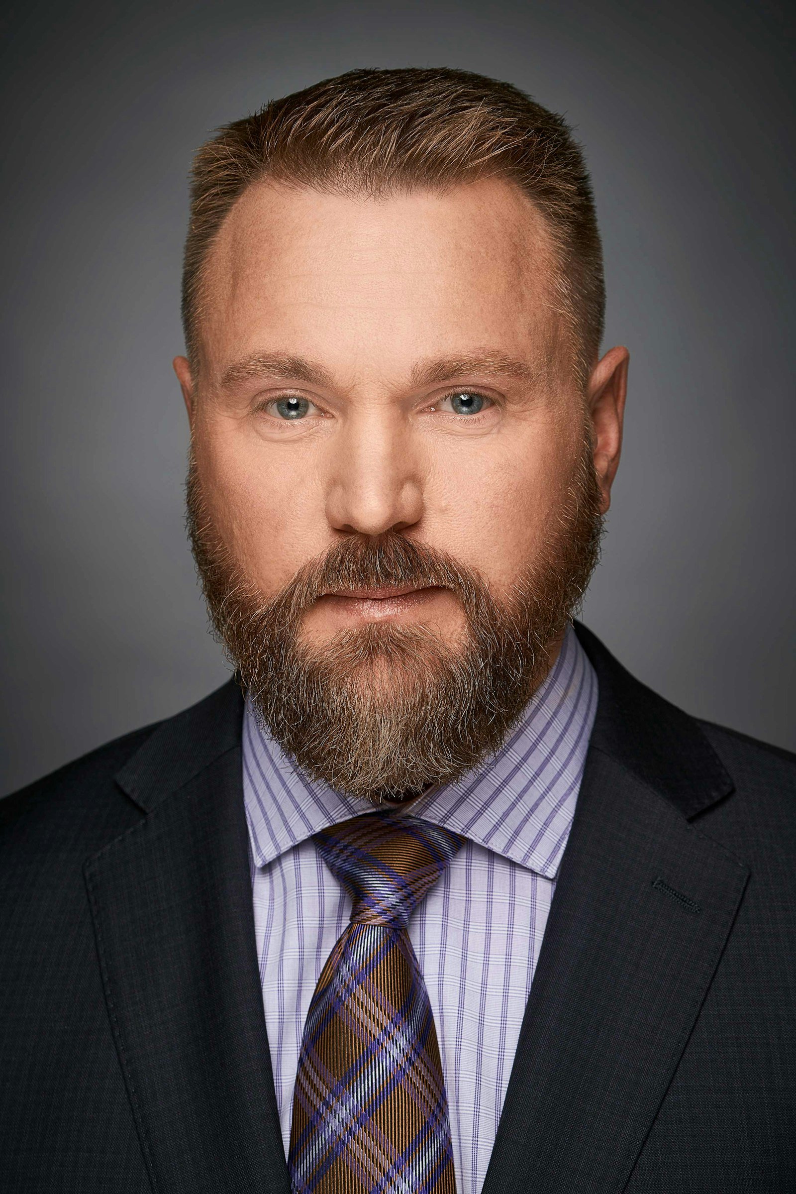 Professional portrait of a man in a suit and tie, the result of a well-prepared corporate photography session in Singapore