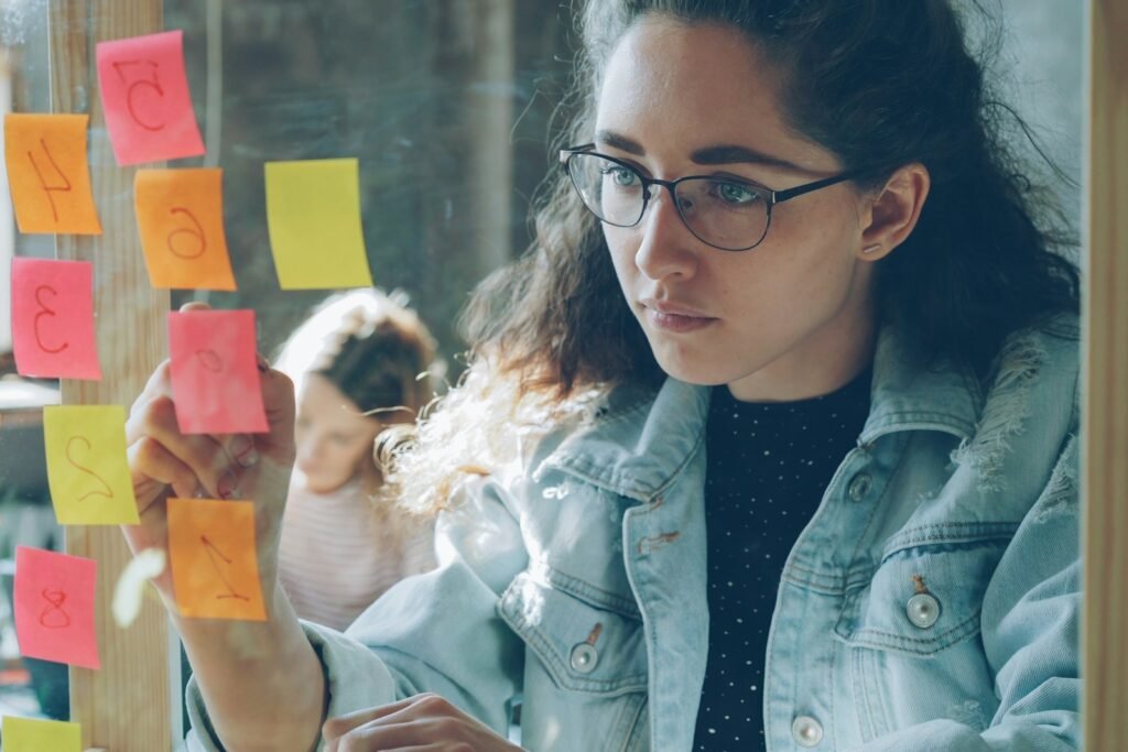 Creative planning with sticky notes, representing performance versus branding advertising