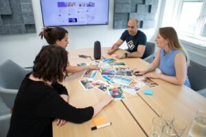 Marketing team brainstorming a campaign around a table