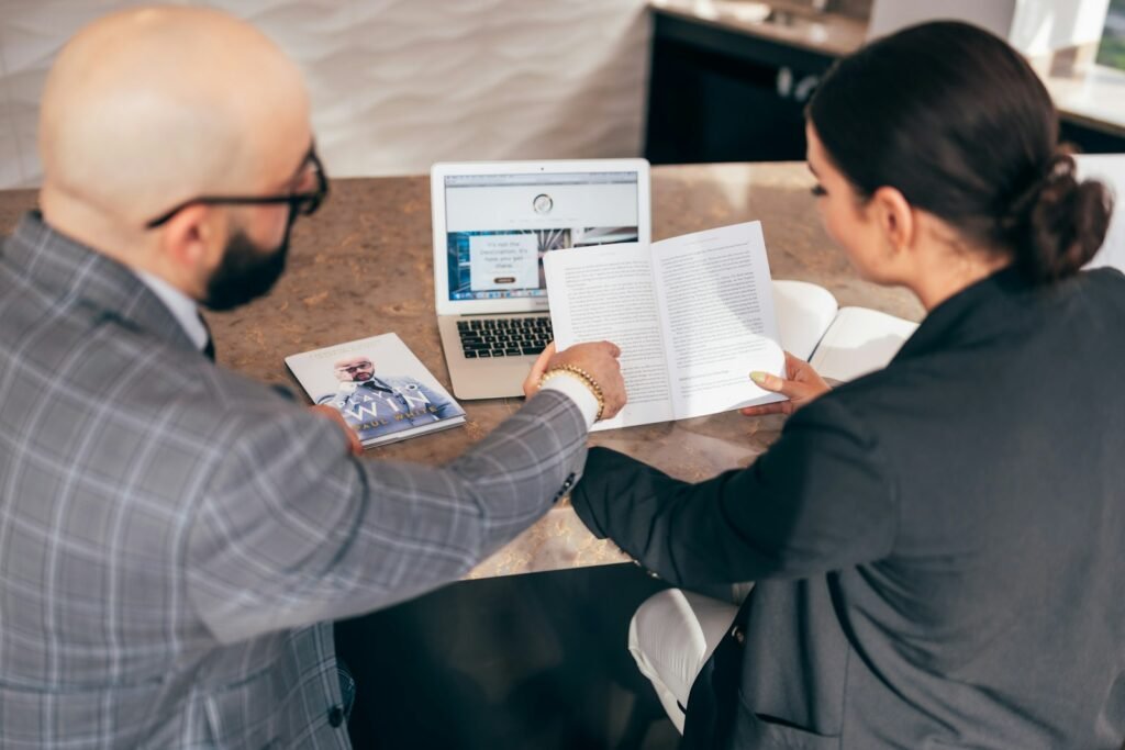 Business owner comparing SEO agency proposals with a consultant