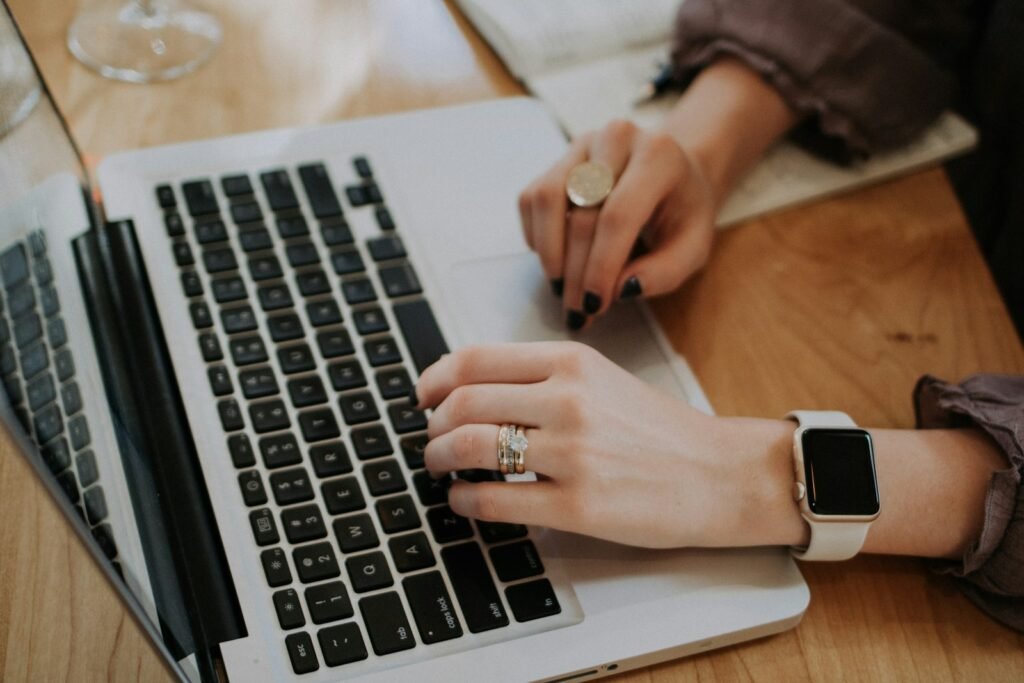 Content writer typing on a laptop, representing content marketing for SEO and lead generation