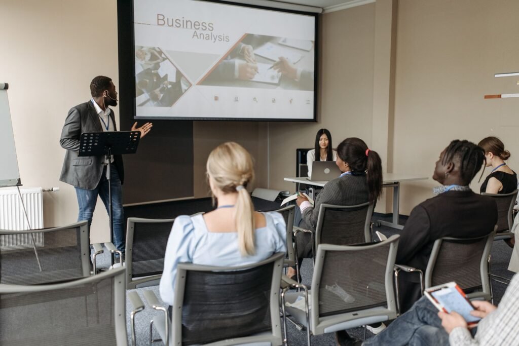 Participants taking notes during a content marketing course in Singapore held in a bright training room.