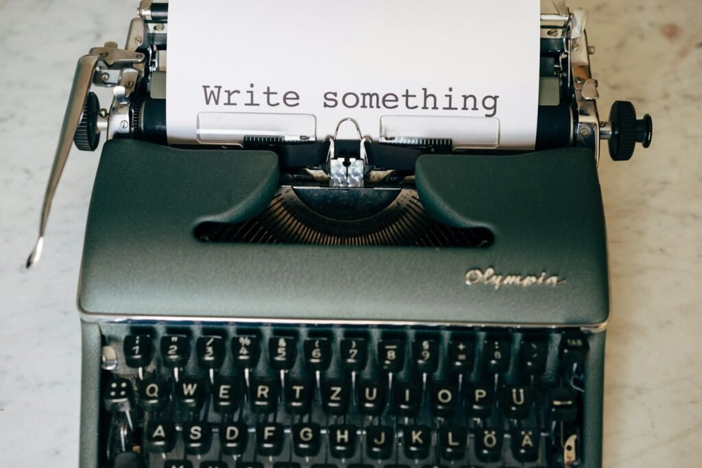 Typewriter with a page reading write something, representing copywriting services