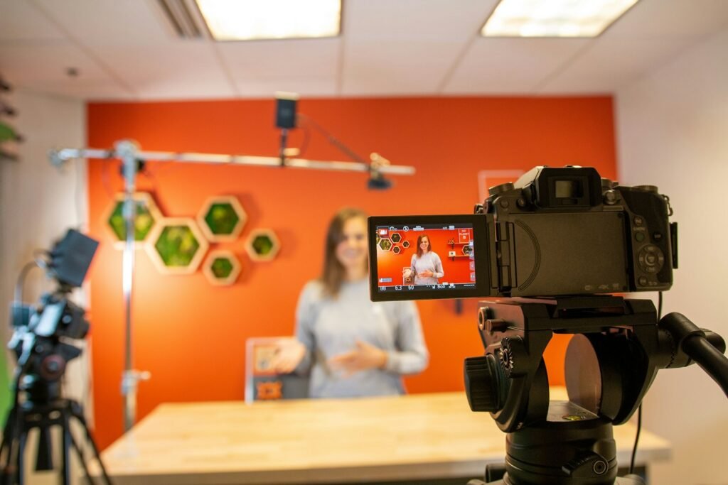 Corporate video interview being filmed on a camera in an office studio