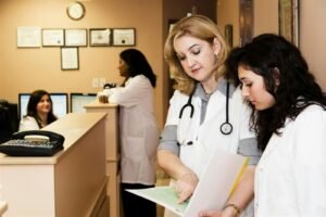 Clinic staff at a reception desk, representing digital marketing for clinics