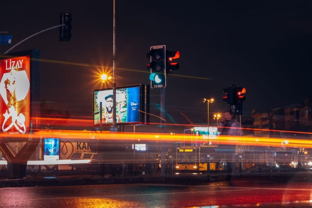 A large outdoor billboard on a city street, the format behind many funny advertisements in Singapore.