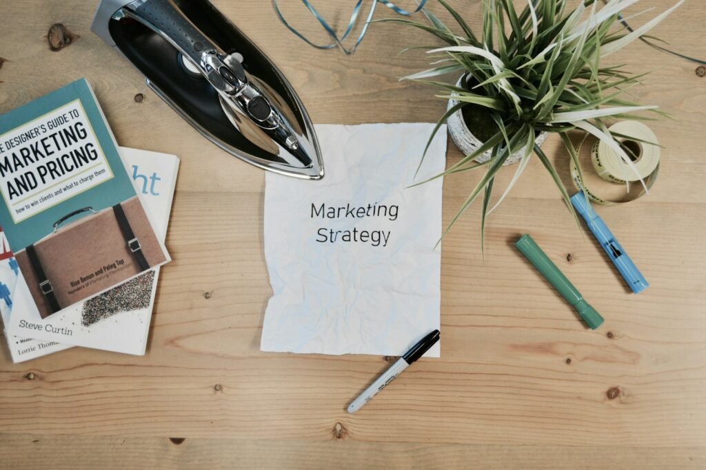 Marketing strategy notes and books on a desk