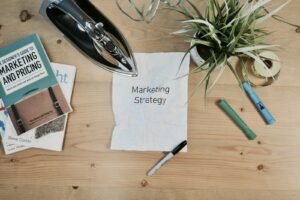 Marketing strategy notes and books on a desk