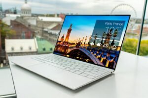 Laptop on a desk by a window, representing ecommerce website design