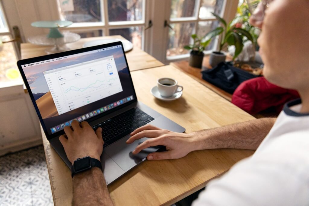Singapore marketing professional comparing Google SEO course options and search ranking data on a laptop.