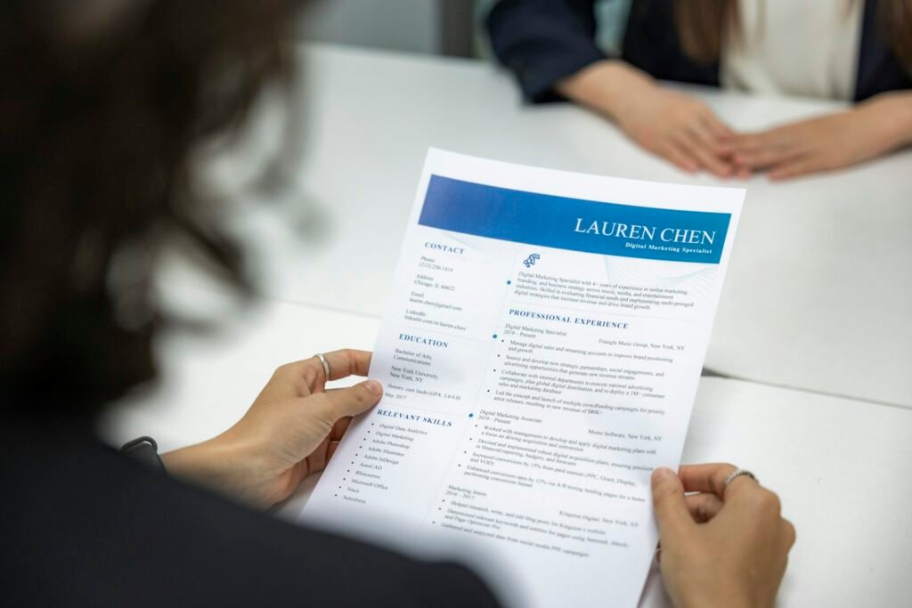 Hiring manager reviewing a resume while hiring an SEO expert