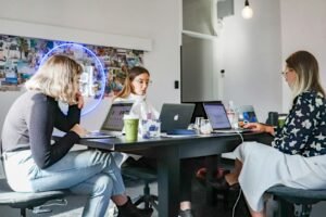 Internet marketing agency team working on laptops in their Singapore office