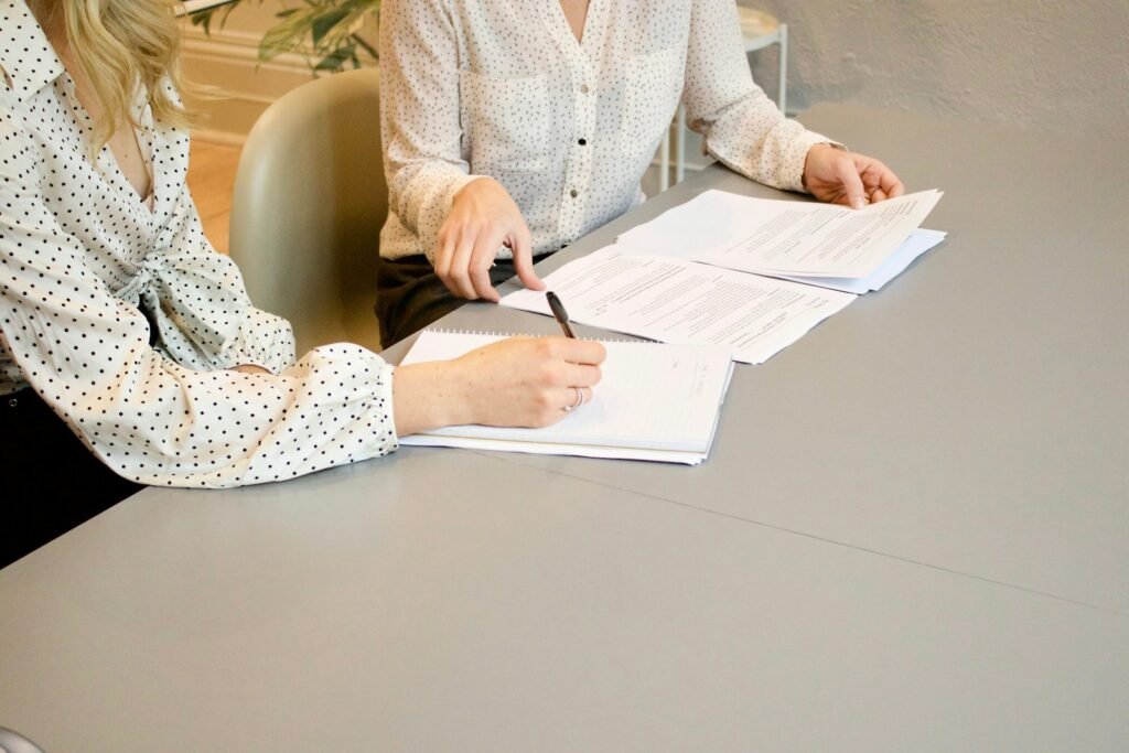 Client and marketing agency signing a retainer or project agreement