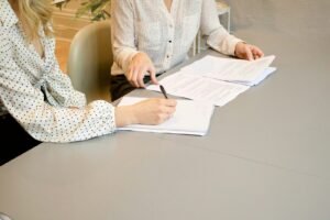 Client and marketing agency signing a retainer or project agreement