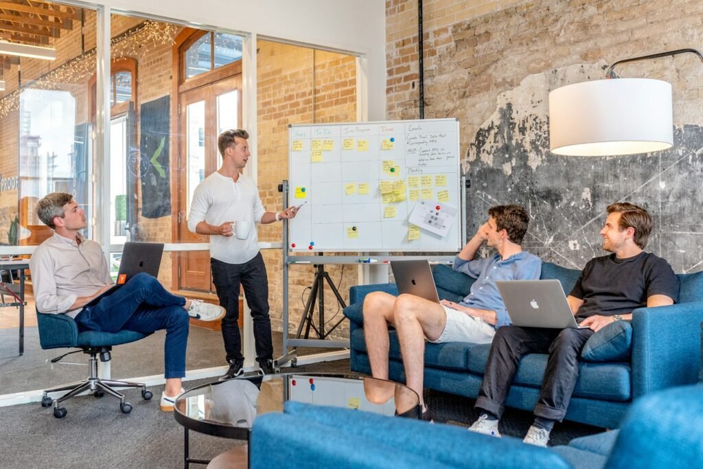 Marketing team planning a campaign strategy at a whiteboard