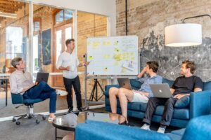 Marketing team planning a campaign strategy at a whiteboard