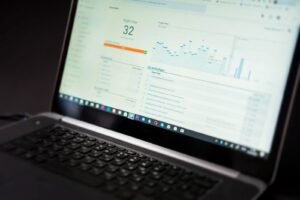 An analyst reviewing referral and authority data on a laptop while working on off-page SEO in Singapore.