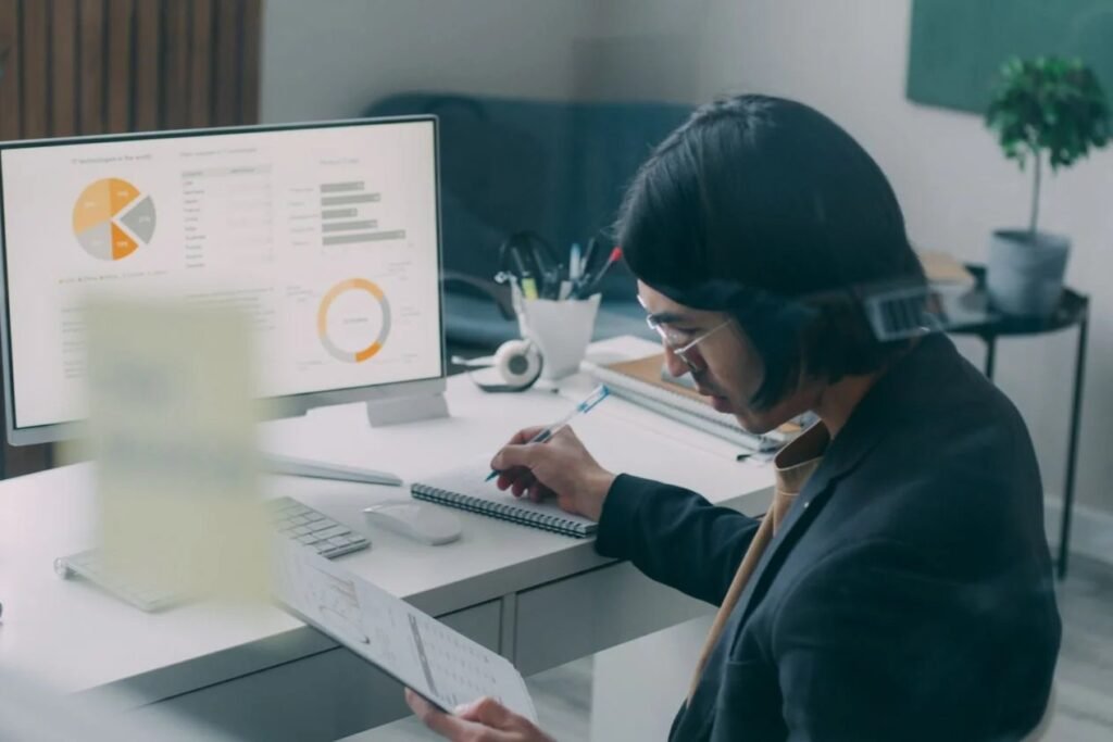 Singapore business owner monitoring online reviews, social comments and brand mentions on a laptop.
