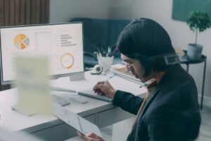 Singapore business owner monitoring online reviews, social comments and brand mentions on a laptop.