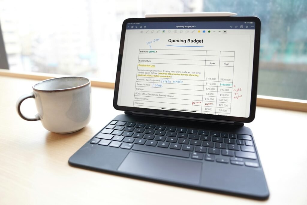 Budget spreadsheet on a tablet, representing PPC budget planning