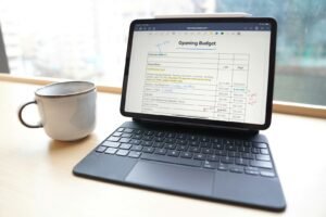 Budget spreadsheet on a tablet, representing PPC budget planning