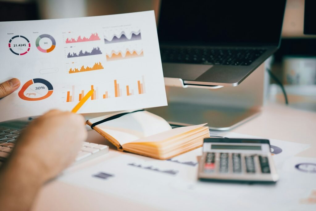 Charts and a calculator on a desk, representing SEO case study results